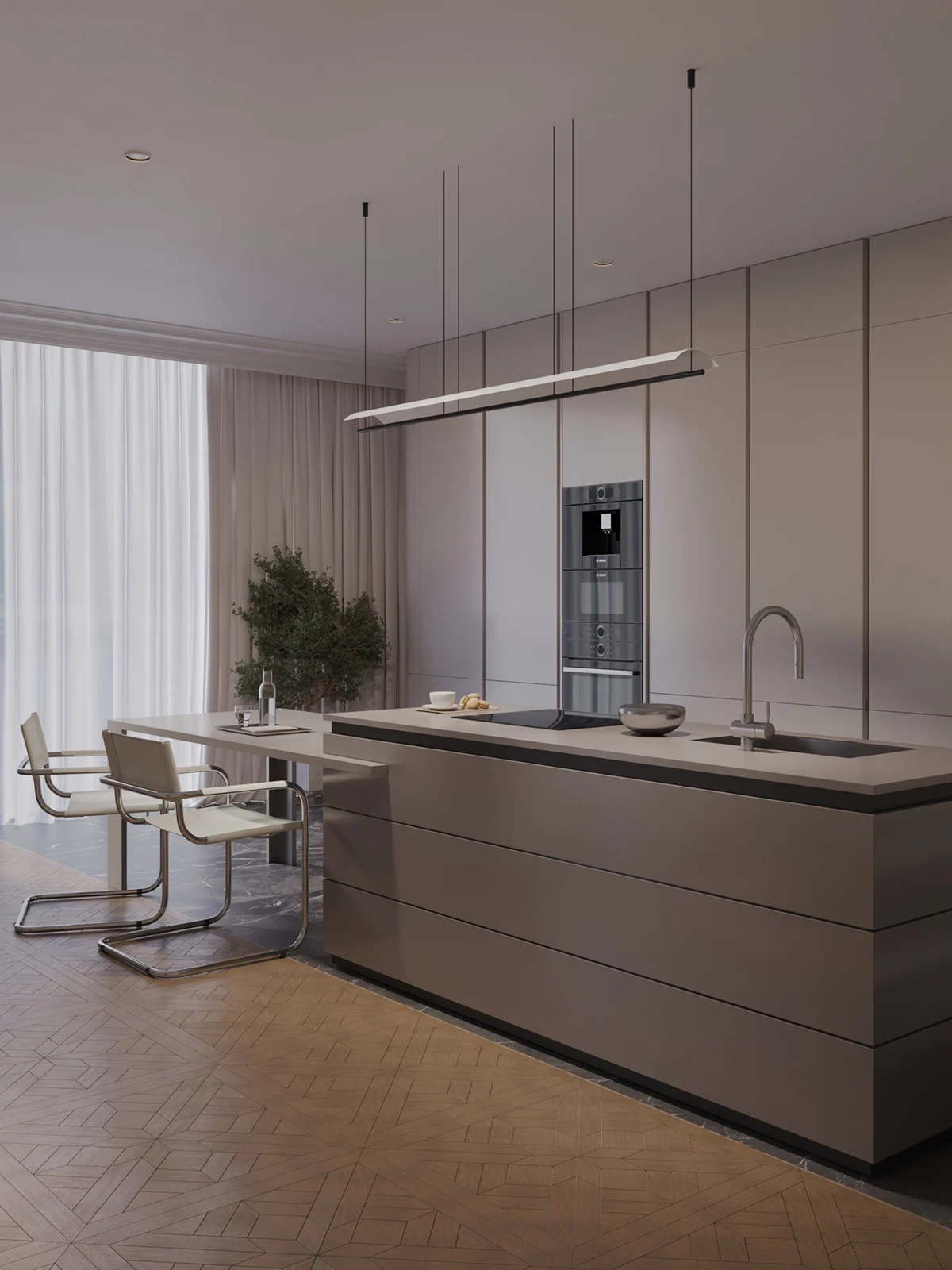 Refined light-wood kitchen with a large marble island, soft drapery, and warm morning light — featuring Maison Révèle's signature blend of elegance and calm.